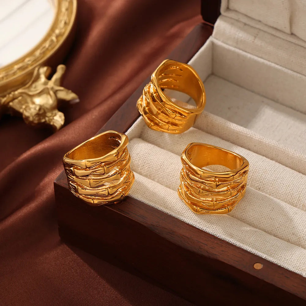 Gold sculptural titanium bamboo ring with textured detail