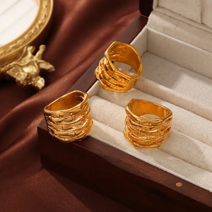 Gold sculptural titanium bamboo ring with textured detail
