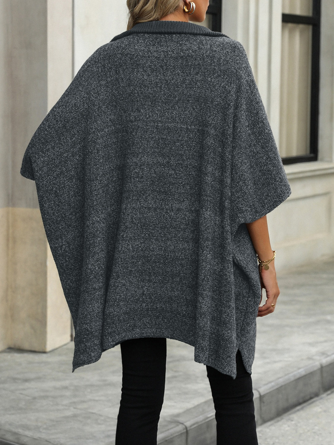 Dark gray knit asymmetrical zip-neck poncho with a textured marled pattern and a relaxed fit.