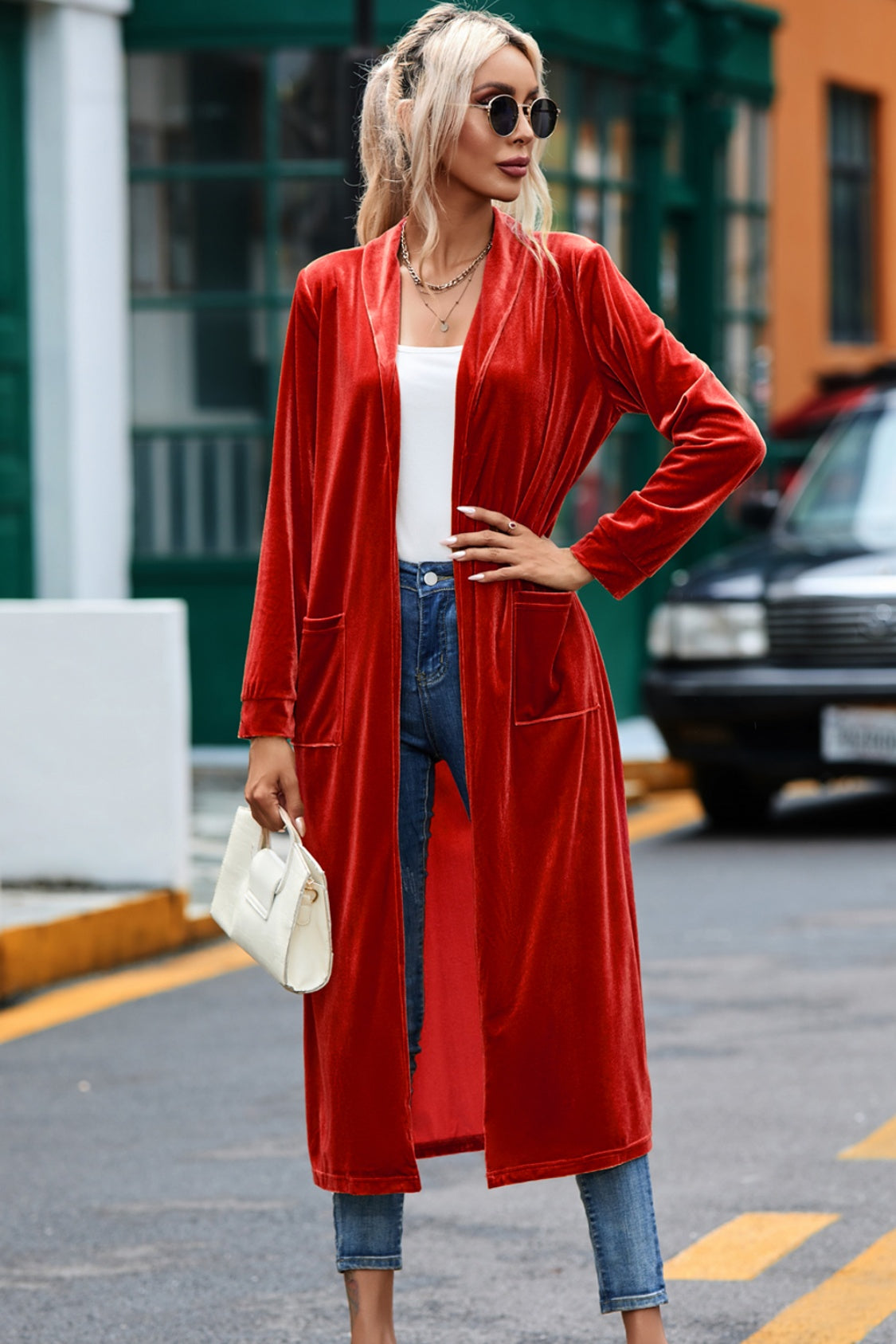 Deep Red velvet duster coat with pockets, open front, long sleeves, and a flowing silhouette.