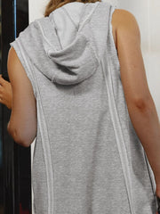 Gray sleeveless hooded romper with raw edges and contrast stitching detail.