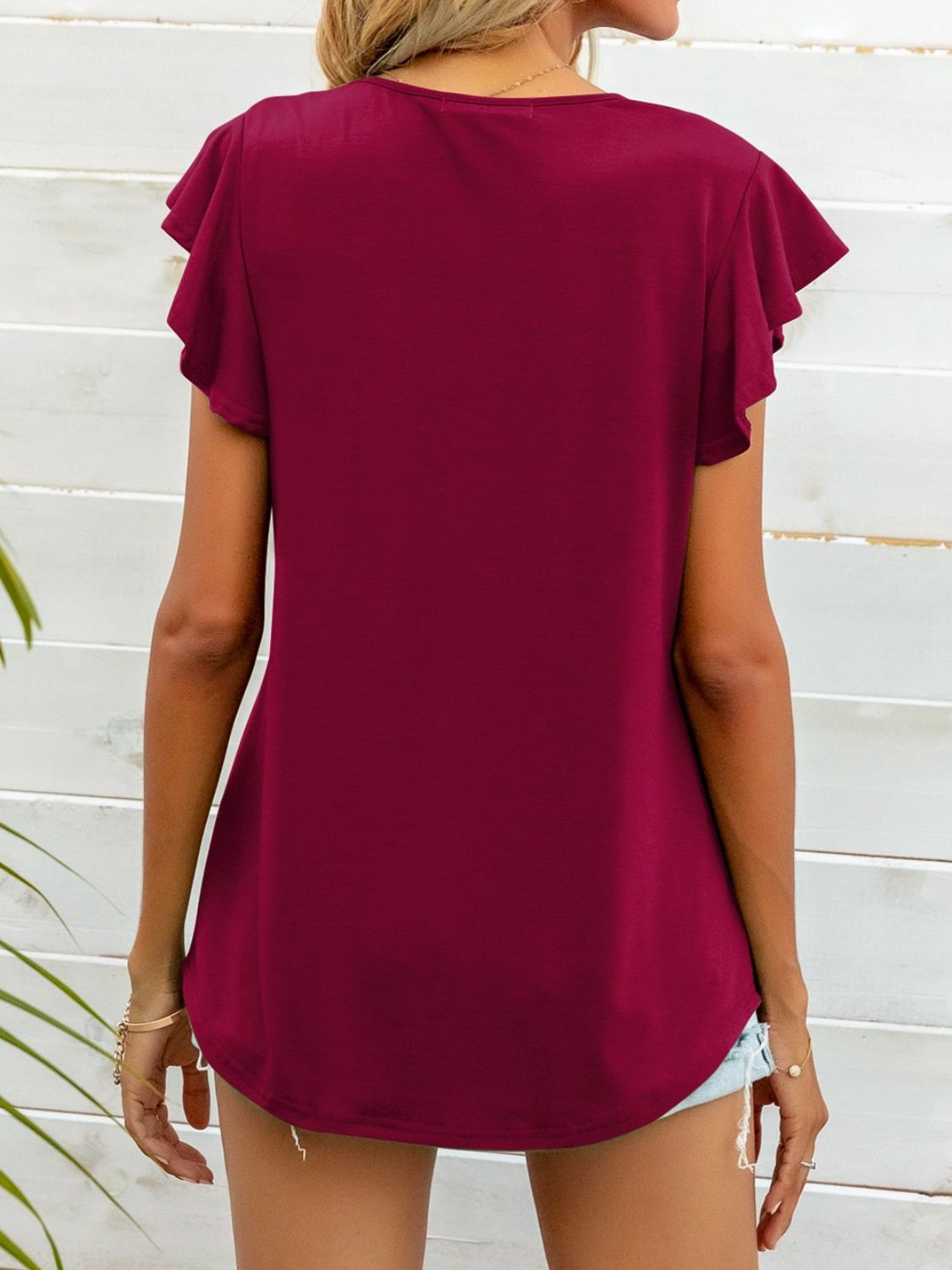 Deep Red ruffled sleeve A-line tee with a rounded hem.