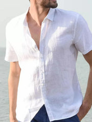 White linen resort shirt, short sleeve, buttoned, relaxed fit, worn open collar
