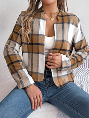 Collarless plaid cropped jacket in camel and white with black accents, open front.