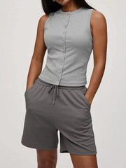 Light gray ribbed button-front tank top with a crew neck and sleeveless design.