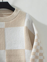 Checkerboard knit sweater in tan and white with crew neck.