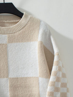 Checkerboard knit sweater in tan and white with crew neck.