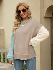 Colorblock drop shoulder knit sweater with tan, cream, and light blue panels.