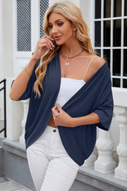 Dark blue open-front crochet kimono sleeve top with a textured pattern.
