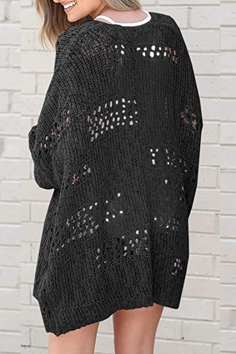 Black open-knit slouchy cardigan with distressed details and a relaxed fit.