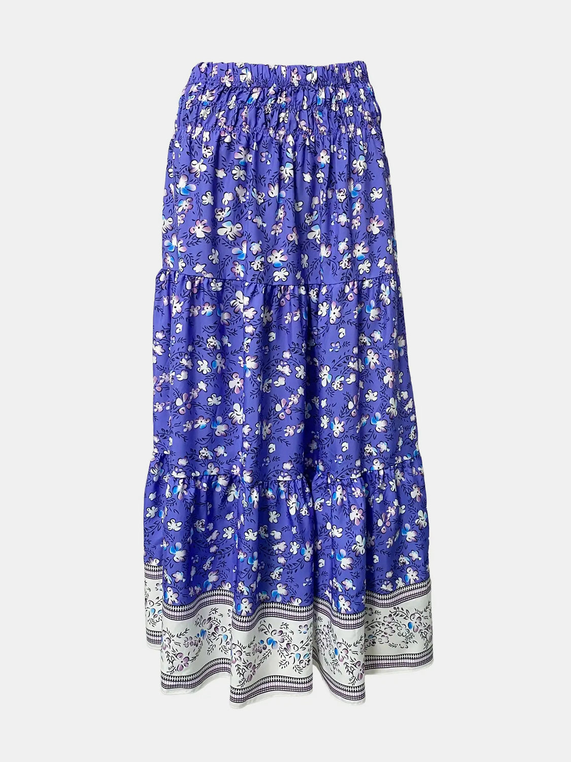 Maxi tiered skirt in blue with a white floral print and border detail.