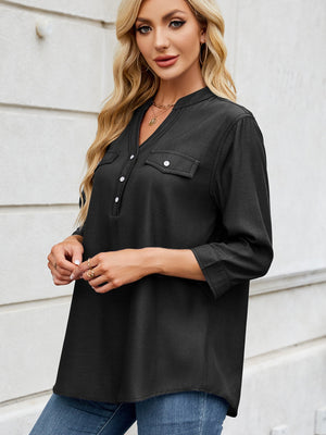 Black denim henley blouse with V-neck, button placket, and chest pockets.