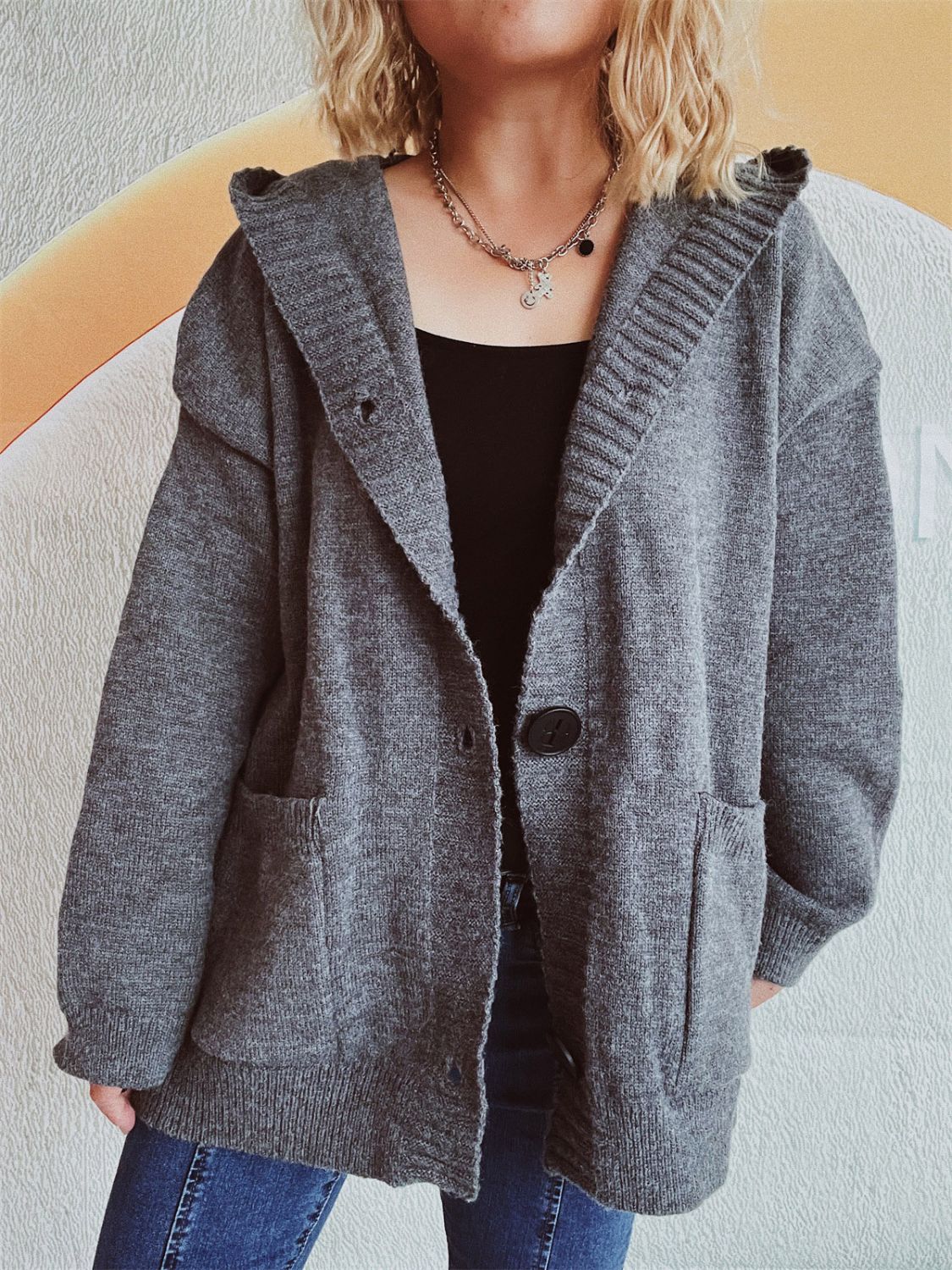 Dark gray chunky knit hooded cardigan with button front and pockets