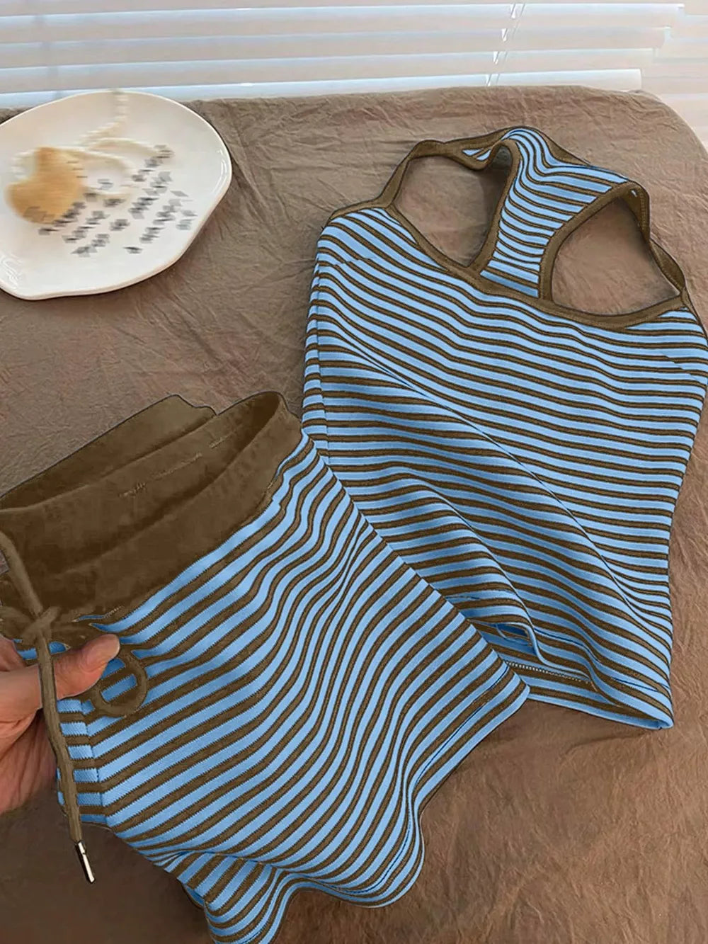 Blue and brown striped loungewear set with drawstring shorts and racerback tank top.