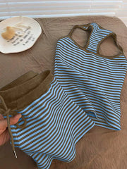 Blue and brown striped loungewear set with drawstring shorts and racerback tank top.