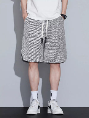 Men's boxer shorts with a black and white abstract pattern and adjustable drawstring.