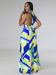 Halter neck pleated maxi dress with bold geometric print and open back.