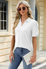 White perforated polo top with ruched short sleeves and a v-neck.