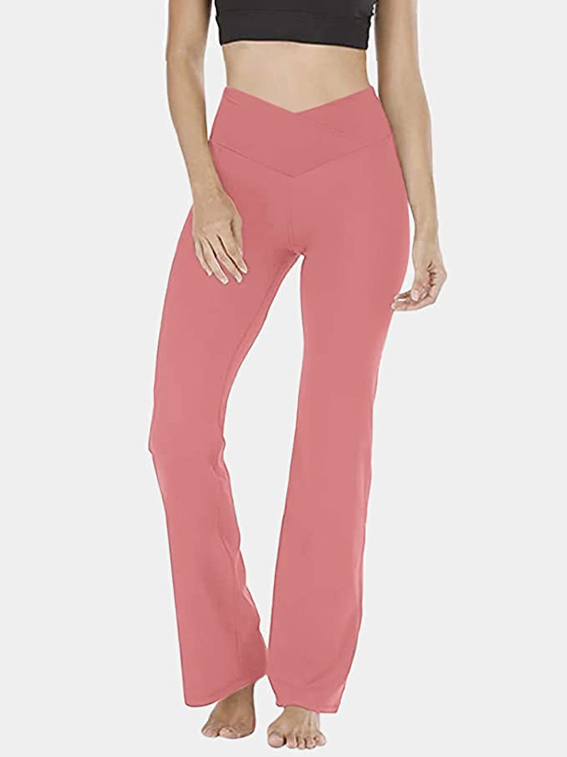 Burnt Coral V-waist flare leg activewear pants with a high rise and bootcut hem.