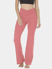 Burnt Coral V-waist flare leg activewear pants with a high rise and bootcut hem.
