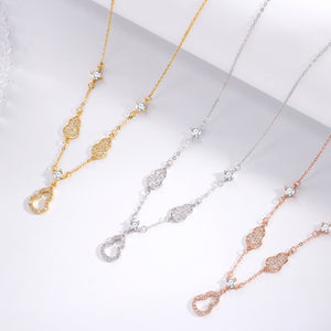 Zircon adorned Y-lariat necklace in gold, silver, and rose gold with delicate gourd charms.