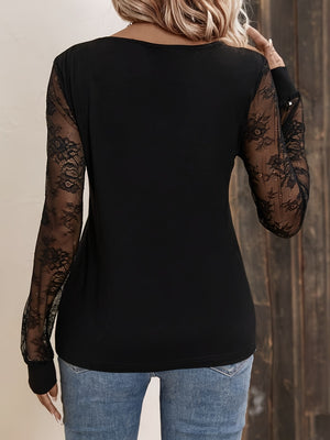 Black blouse with V-neck and sheer lace long sleeves.