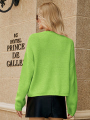 Textured button-down knit cardigan in yellow-green with ribbed detail.