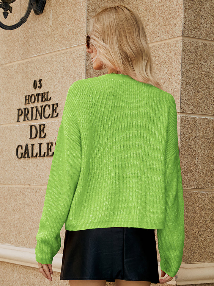 Textured button-down knit cardigan in yellow-green with ribbed detail.