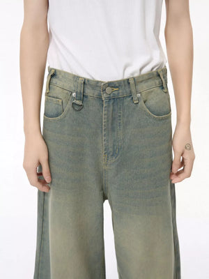 Wide leg jeans in air force blue cotton blend with button fly and distressed wash.