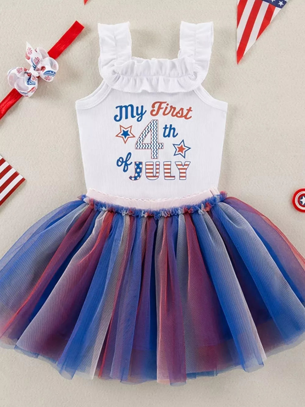Baby girls' white "My First 4th of July" tutu dress with ruffled neckline and red, white, and blue tulle skirt.