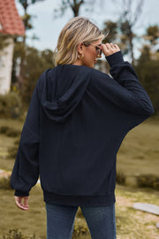 Dark Blue textured cable knit zip-up hoodie with a relaxed fit and balloon sleeves.