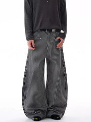 Men's black and white striped wide-leg sweatpants with a relaxed fit.