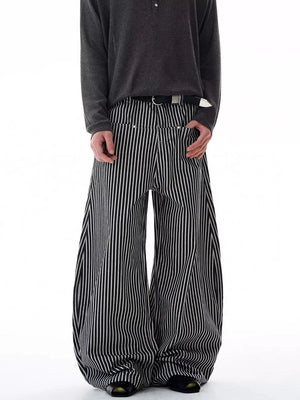 Men's black and white striped wide-leg sweatpants with a relaxed fit.