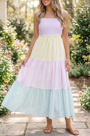 Maternity tiered dress with pastel colorblock stripes, scalloped trim, and sweetheart neckline.