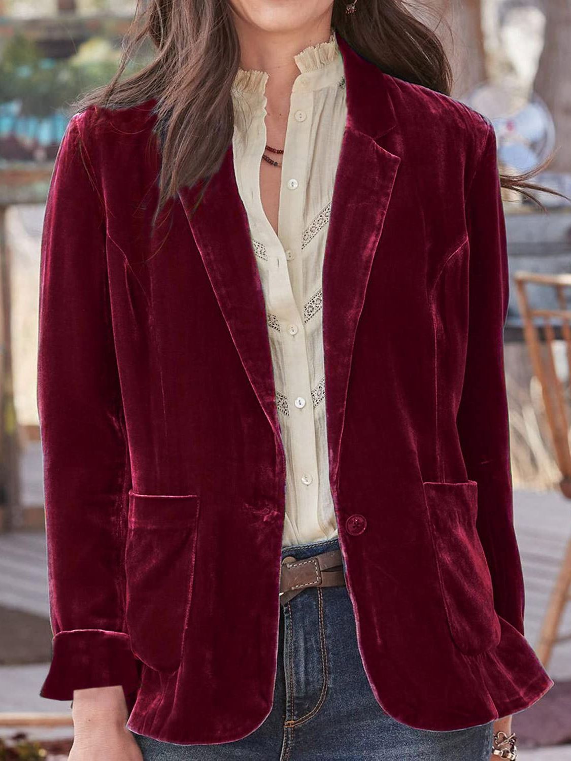 Burgundy velvet blazer with rolled cuff detail and buttoned front.