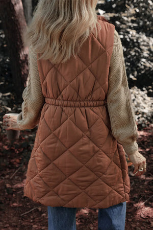 Brown diamond quilted longline vest with elastic waist detail and crew neck sweater.
