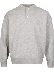 Light gray knit sweater with button detail and drop shoulders