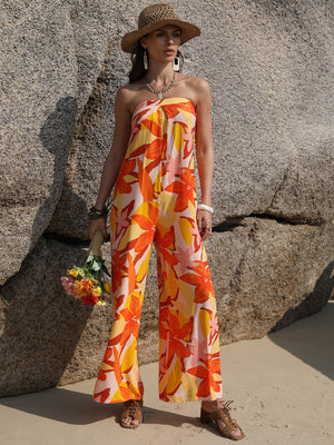 Strapless floral print jumpsuit in tangerine with wide legs and tie back detail.