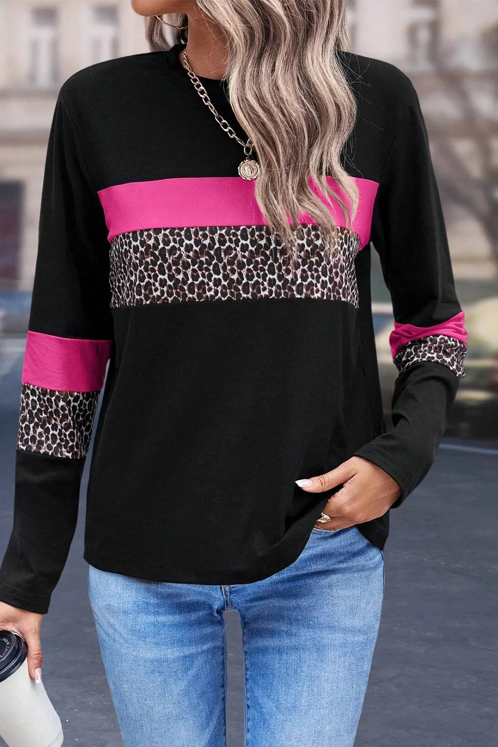 Black long sleeve tee with fuchsia pink and leopard print colorblock panels.