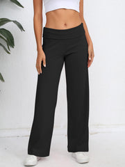 Black palazzo trousers with fold-over waistband, wide leg, and full length.