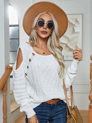 White cable knit cold-shoulder sweater with button detail and scoop neck.