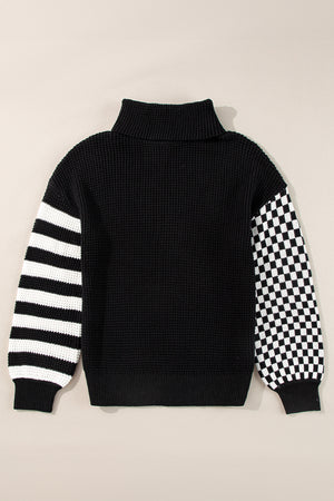 Black knit turtleneck sweater with checkerboard and stripe sleeves