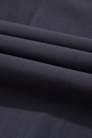 Dark gray gathered-leg jumpsuit fabric detail