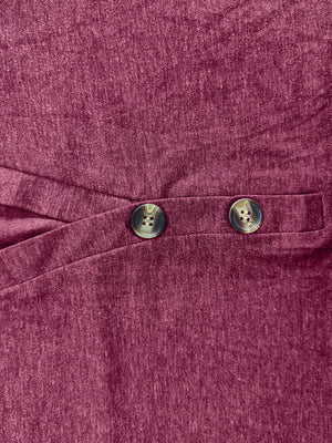 Buttoned Henley slouch tee in cerise with two decorative buttons and a crossover detail.