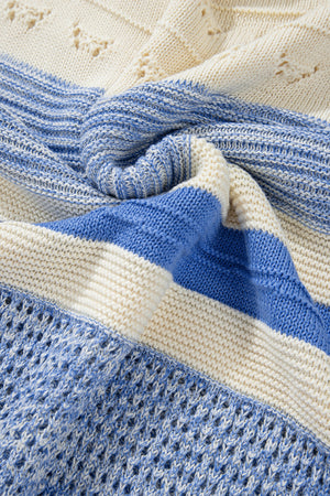 Light blue and cream striped knit sweater with eyelet yoke detail.