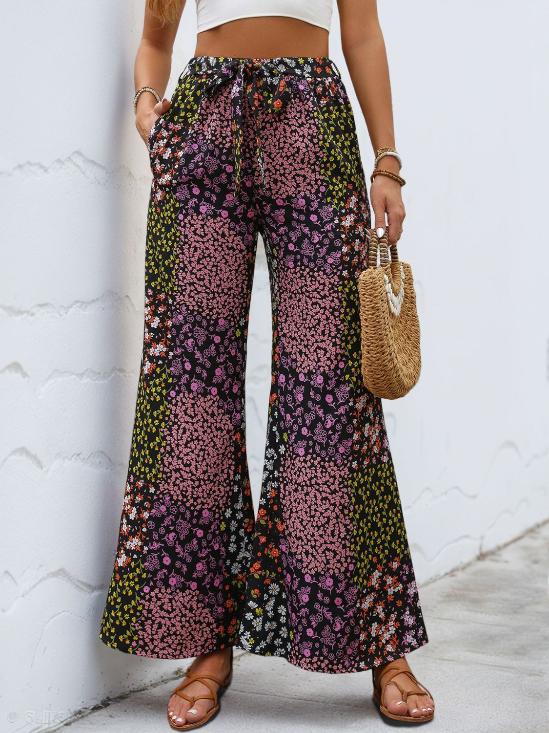Black floral panel palazzo trousers with a tie waist and wide leg
