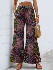 Black floral panel palazzo trousers with a tie waist and wide leg