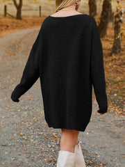 Black oversized ribbed knit mini dress with a boat neck and long sleeves.
