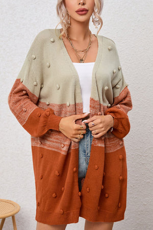 Textured colorblock acrylic cardigan in pink and caramel with bobble details and a V-neck.
