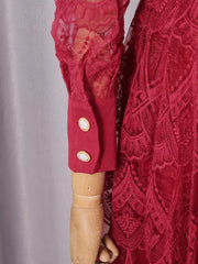 Red lace midi dress with button placket and ornate detail on cuff.